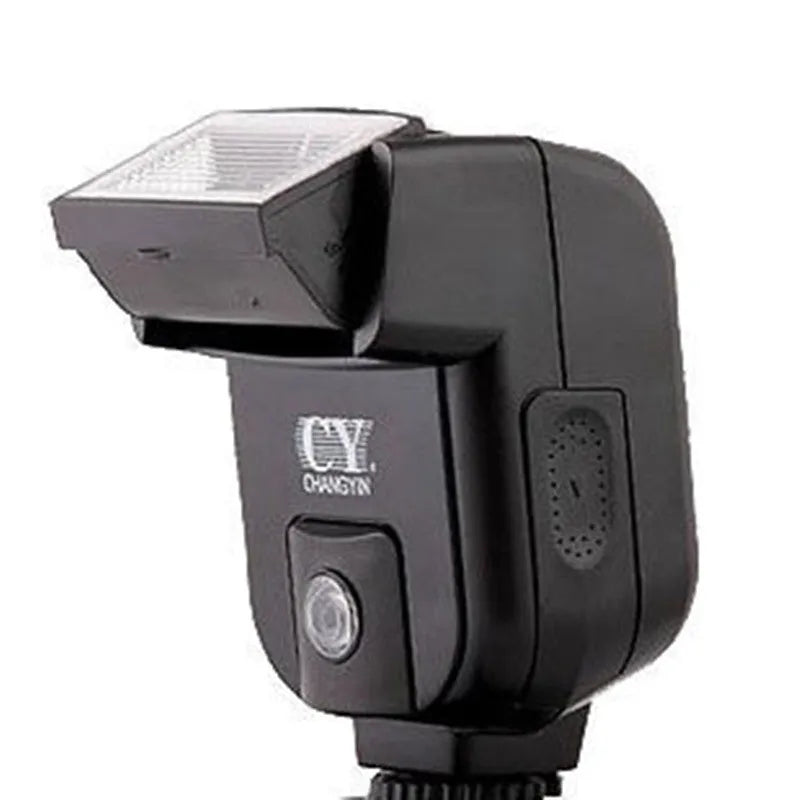 Compact silver hot shoe camera flash unit with head tilted upwards, shown on a camera.