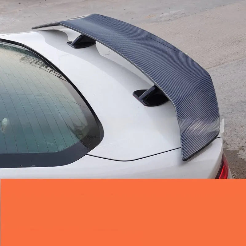 Universal punch-free car spoiler in ABS plastic shown in bright black finish.