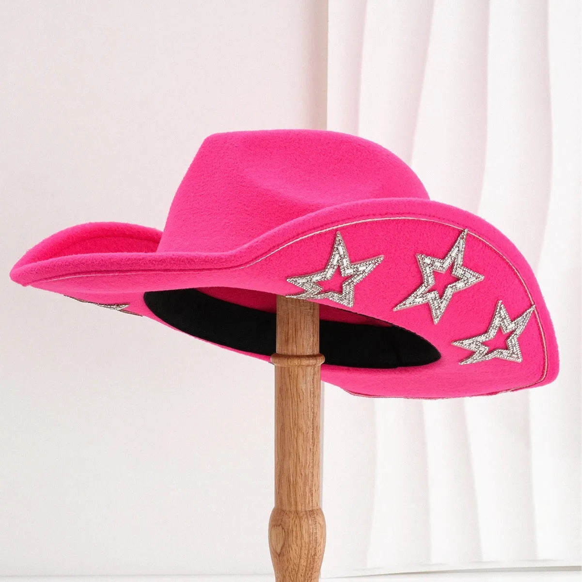 Beige woven polyester western top hat with a conical crown and a hexagonal star decoration on the front.