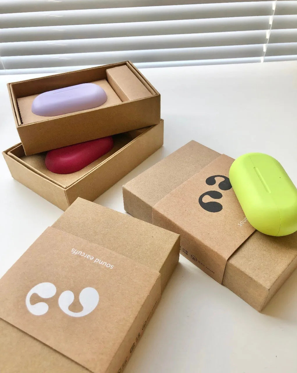 Bone conduction ear clip headset in macaron colours with Qualcomm chip and 20 metre range
