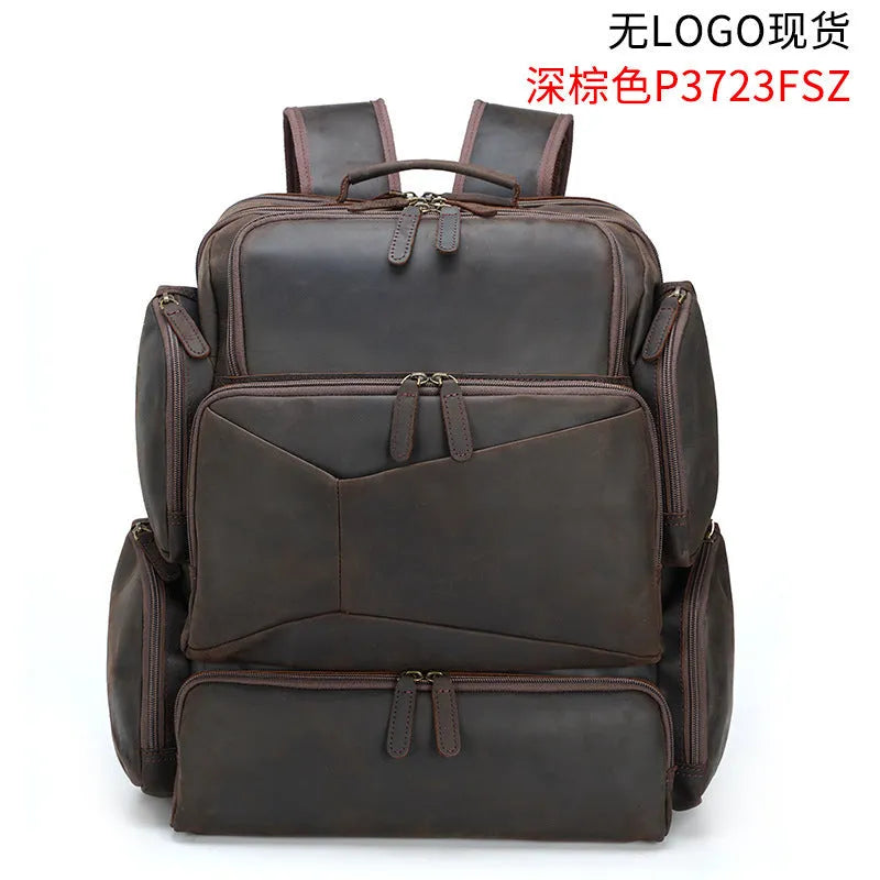 Dark brown genuine leather backpack for men showing embossed texture, double straps, and open compartments.