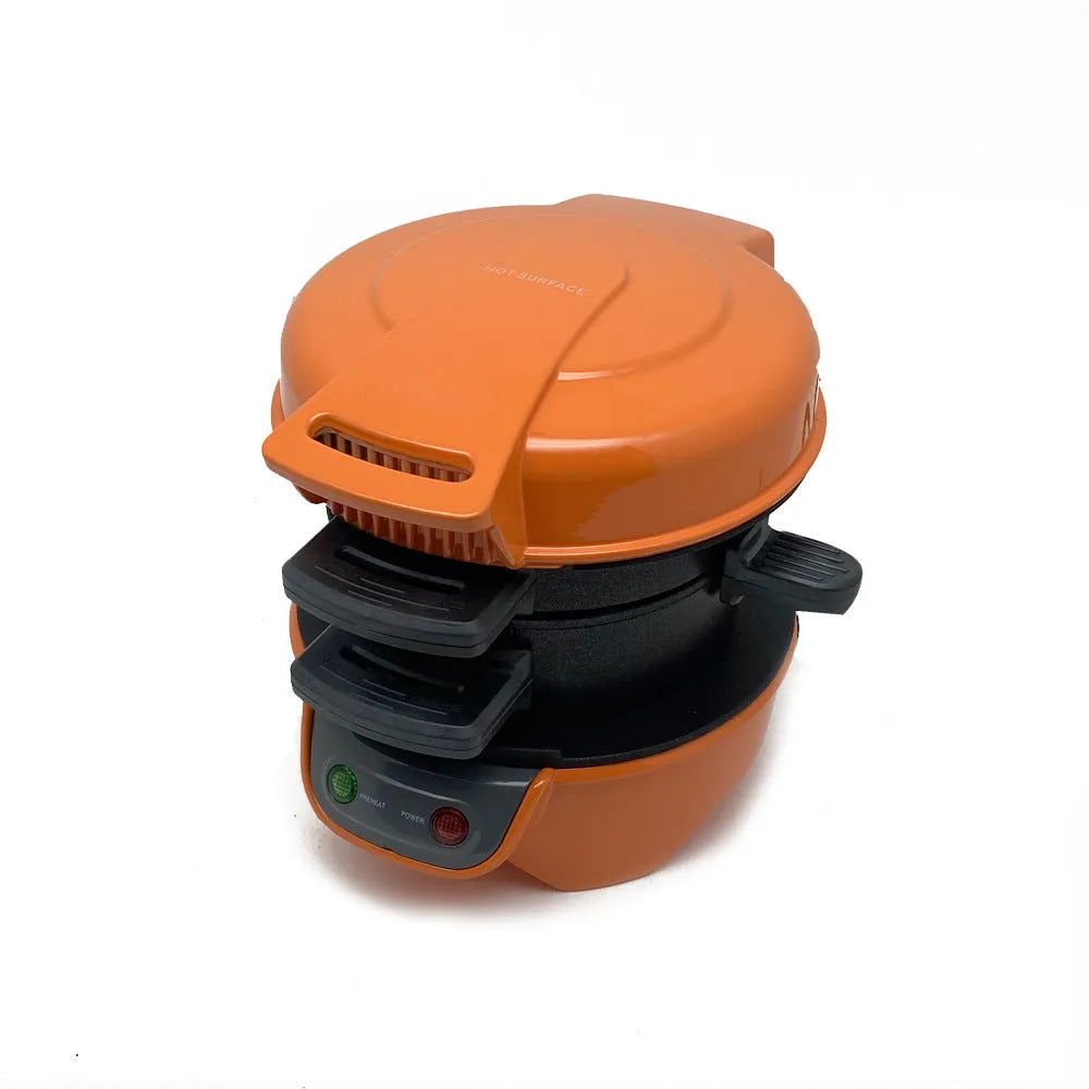 Bright red breakfast sandwich maker with egg cooking ring and waffle plates on kitchen counter