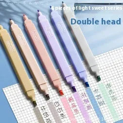 Set of double headed fluorescent highlighter pens showing two different coloured tips on each pen.