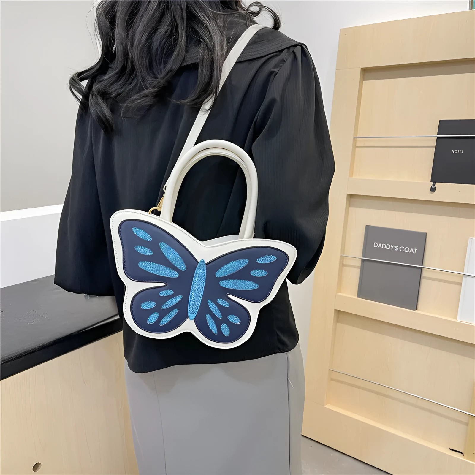 Small square white PU leather crossbody bag with contrast detailing, shown from the front.
