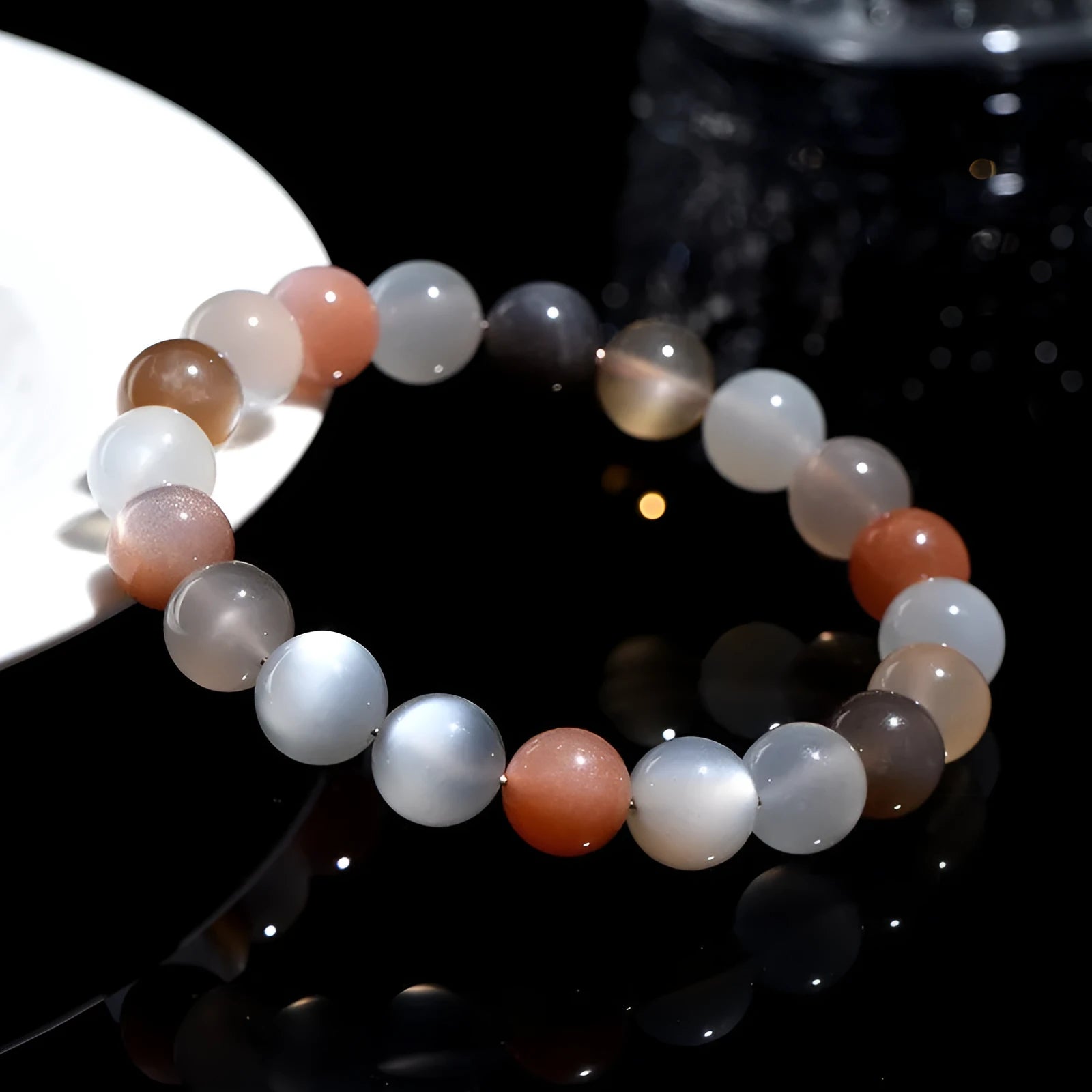 Natural colourful moonlight moonstone bracelet with 8mm beads on a white background.