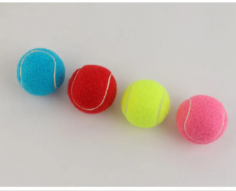 Bite-resistant rubber dog tennis ball in multiple colours including pink, blue and green