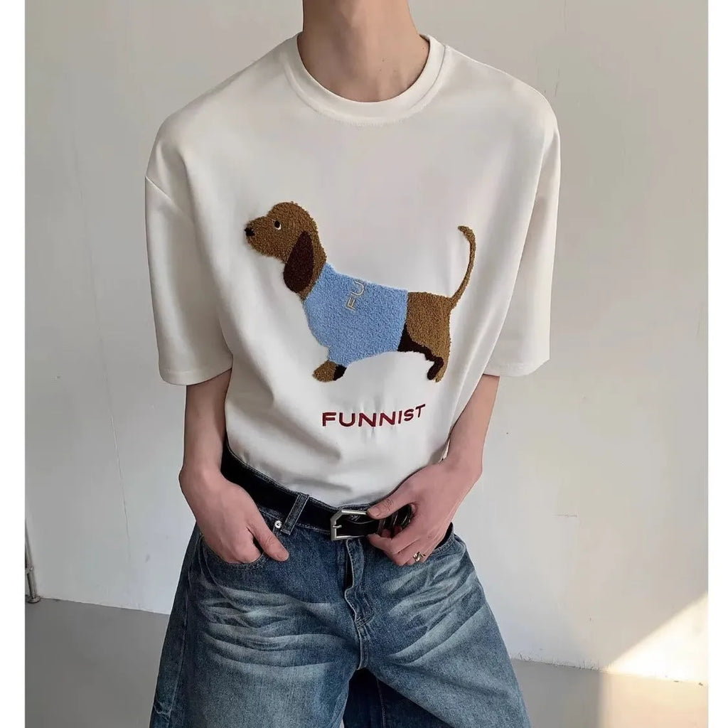 Men's gray cotton t-shirt with an embroidered cartoon sausage dog holding a blue towel.