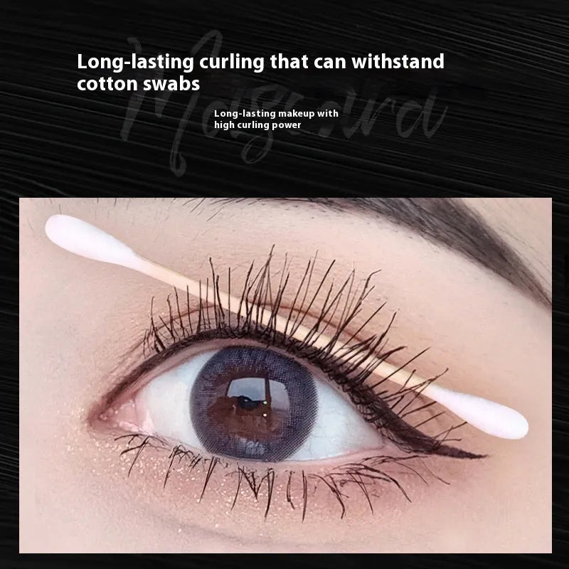 Black natural curly long mascara container with curved brush applicator showing 14cm length