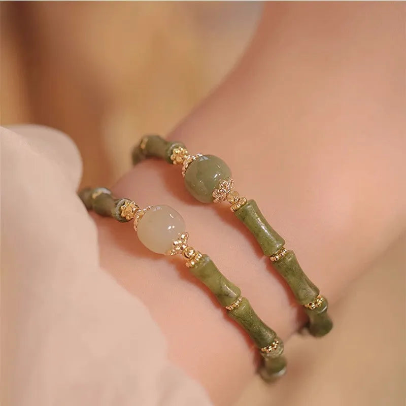 Women's simple geometric Hetian jade bangle bracelet in dark green and light colour options.
