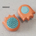 Blue pet bath brush and massage comb for dogs and cats with integrated shampoo box.