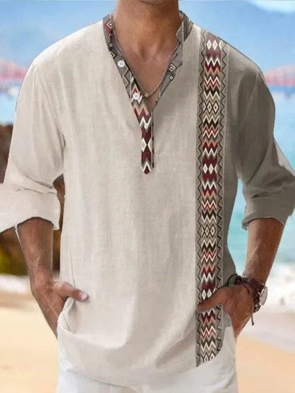 Man wearing a thin, striped long sleeve Hawaiian-style casual shirt in lilac.