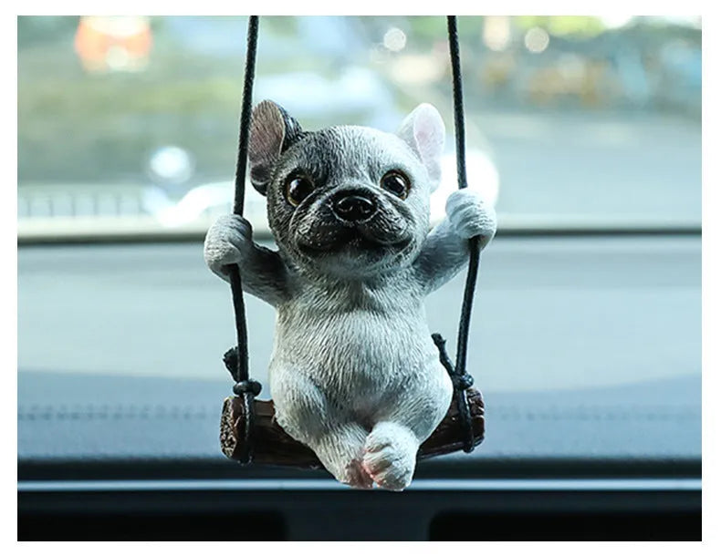 Cartoon-style resin bulldog car pendant hanging ornament in black, white, or yellow.