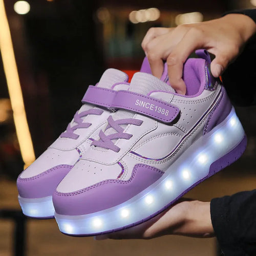 Children's rechargeable flashing roller skates with LED lights in pink, showing UK size markings
