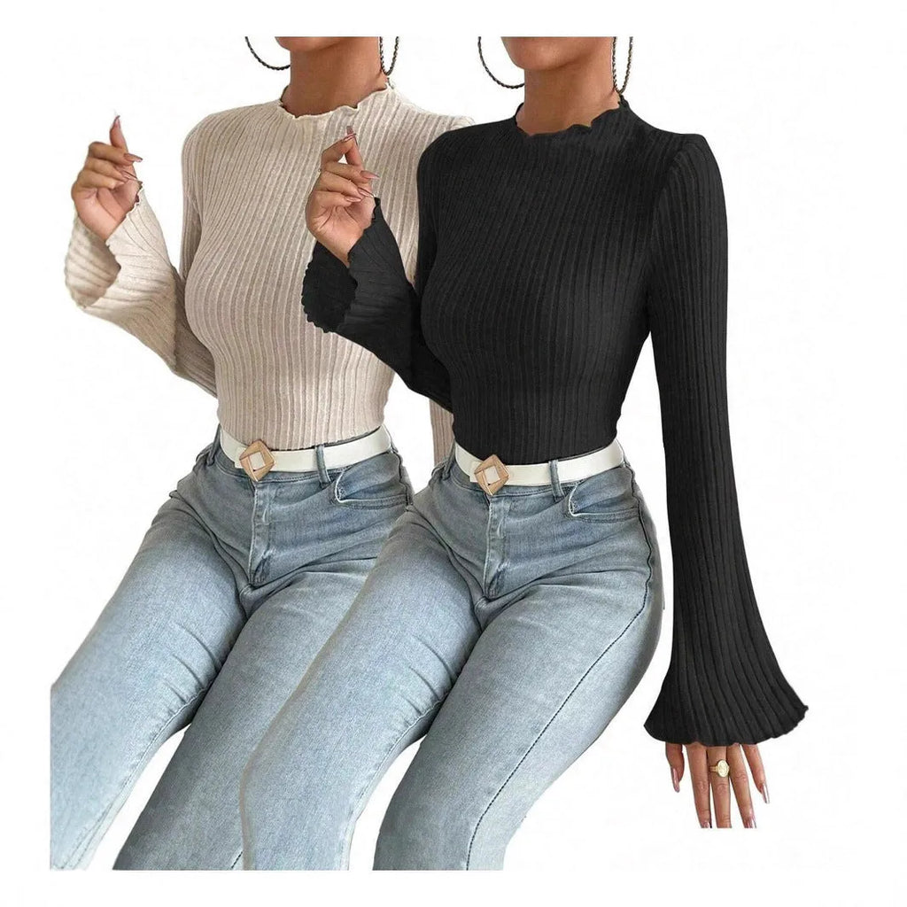 Long sleeve black top with lantern sleeves and sunken stripe texture, laid flat.