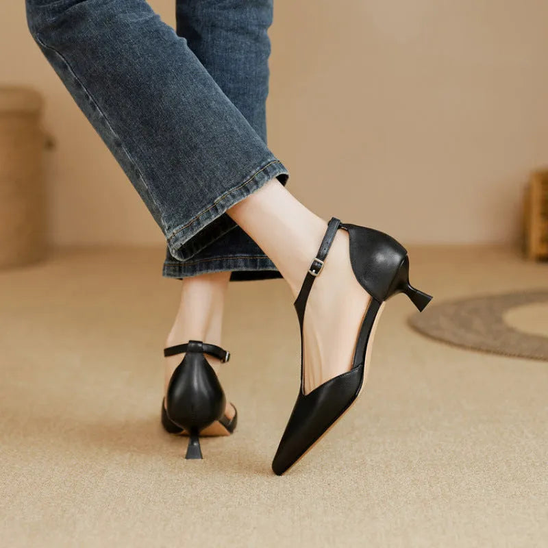 Brown and black women's pointed toe high heels made from cowhide leather.
