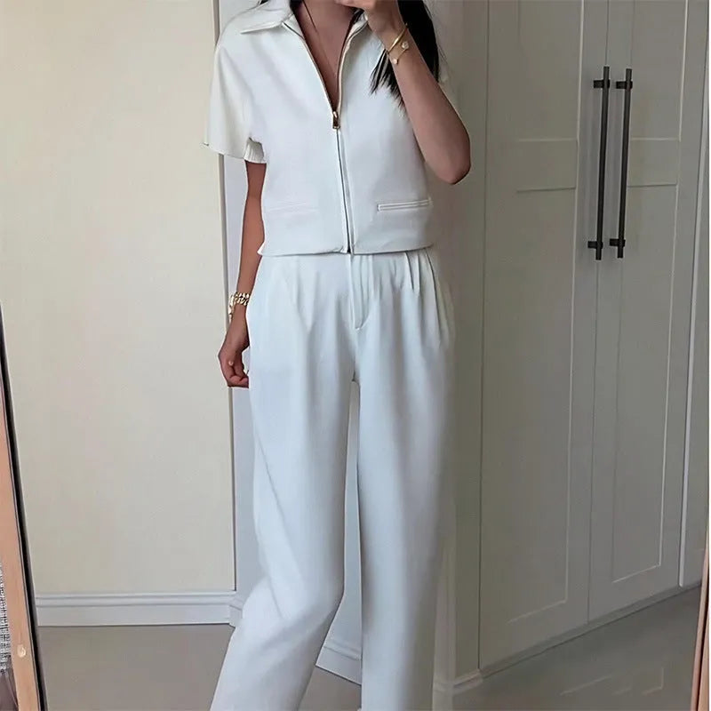 Loose-fit short-sleeve polyester casual top on a hanger, shown in white, black, and yellow colour options.