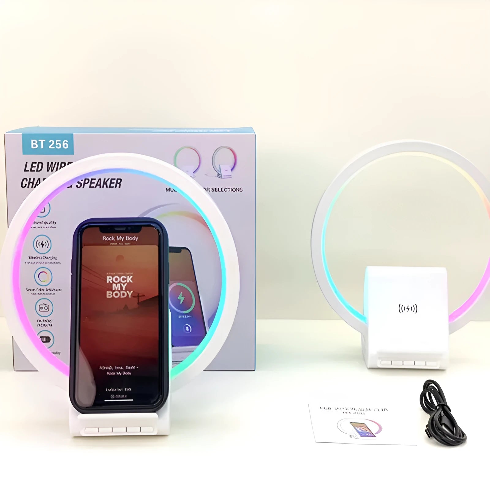 White smart Bluetooth speaker with wireless charging surface and ambient lighting