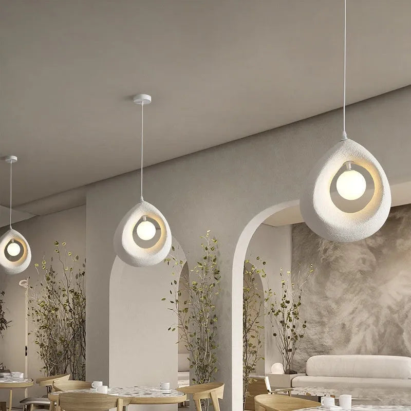 Retro modern chandelier with milky white shade hanging as pendant light