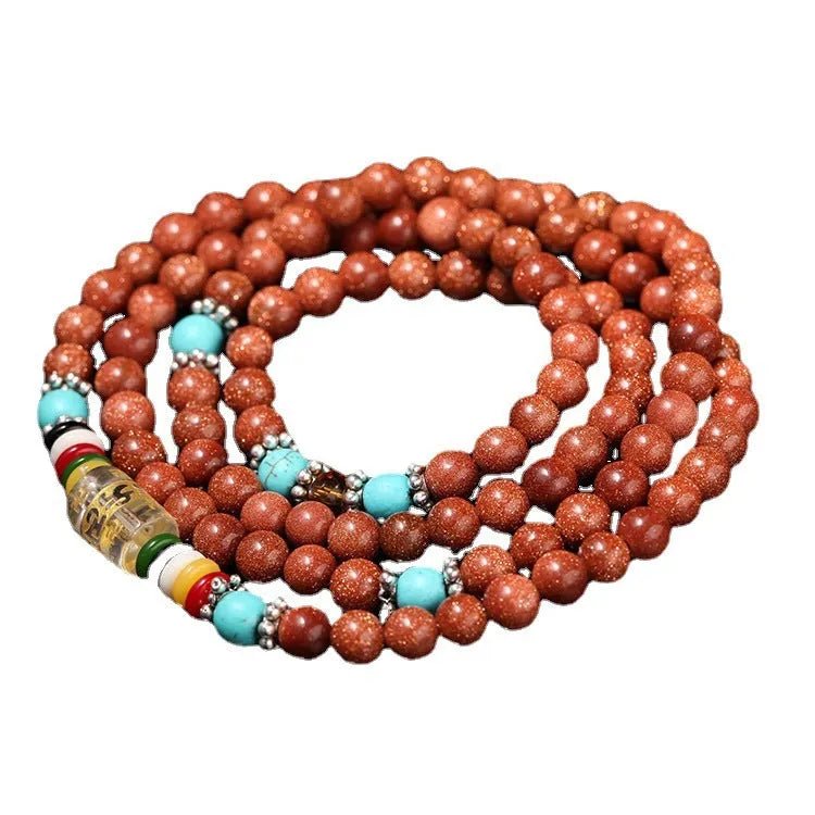 Golden star stone bracelet with 108 nugget sand beads and a fu character charm.