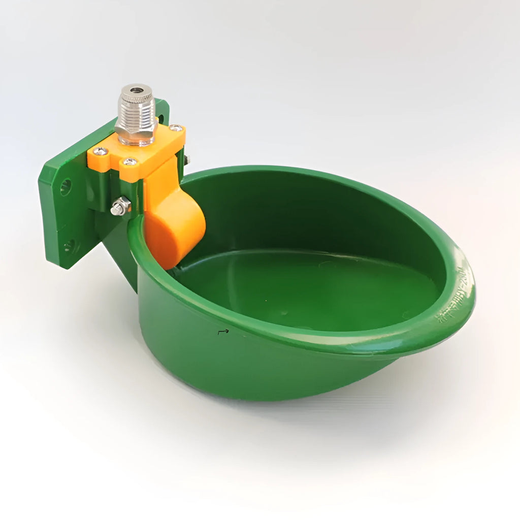 Green plastic automatic drinking bowl for sheep and pigs on farms
