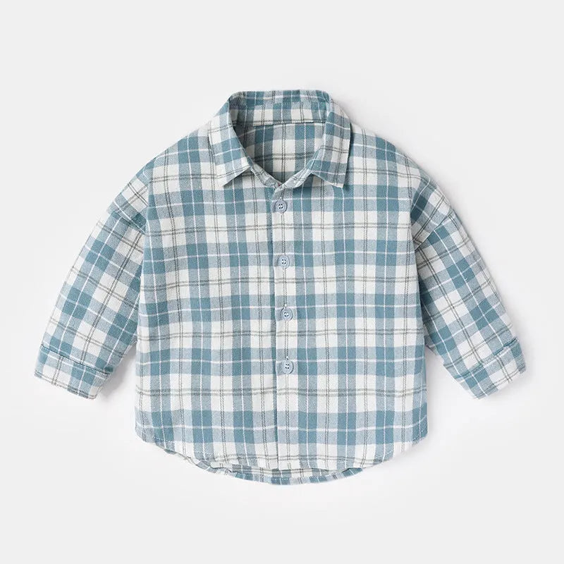 A boys' long sleeve cotton shirt with a lattice and cartoon pattern, shown in a light blue colour.