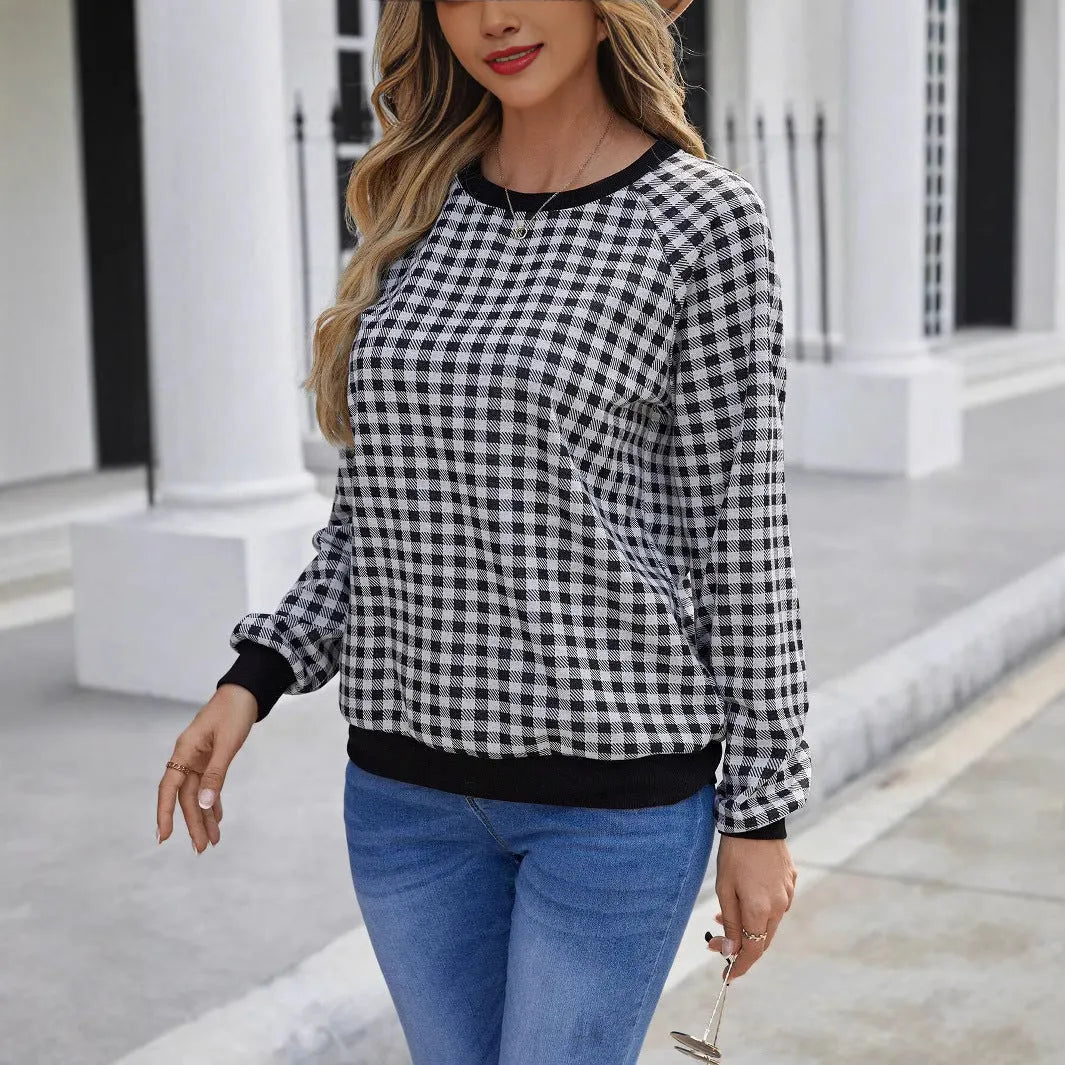 Black long sleeve pullover sweater with a classic plaid stripe print pattern.