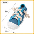 Yellow plastic dog slippers chew toy with a squeaker on a white background.