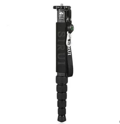 Black carbon fibre six-section SLR camera monopod extended to its maximum height.