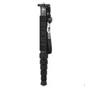 Black carbon fibre six-section SLR camera monopod extended to its maximum height.