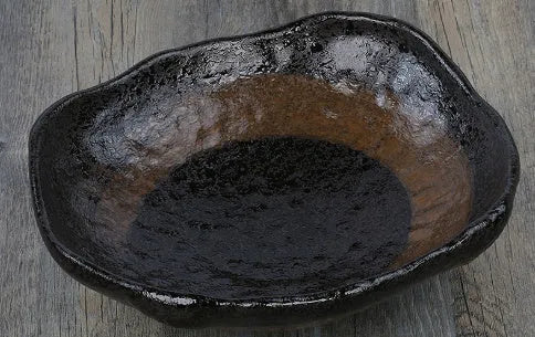Creative ceramic Japanese-style irregular shaped bowl with floral decoration and sauce dish