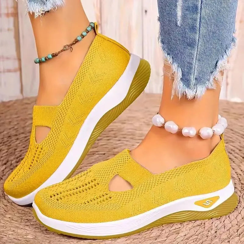 Women's casual flat mesh shoes with T-strap in assorted colours on soft PVC sole