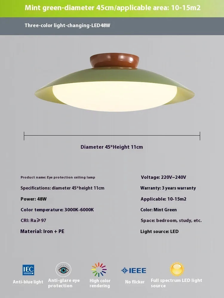Modern cream style flying saucer shaped ceiling lamp in an iron shade.