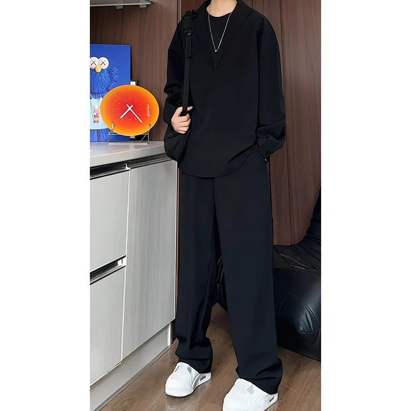 Men's black casual two-piece set with long sleeve polo shirt and trousers on a hanger