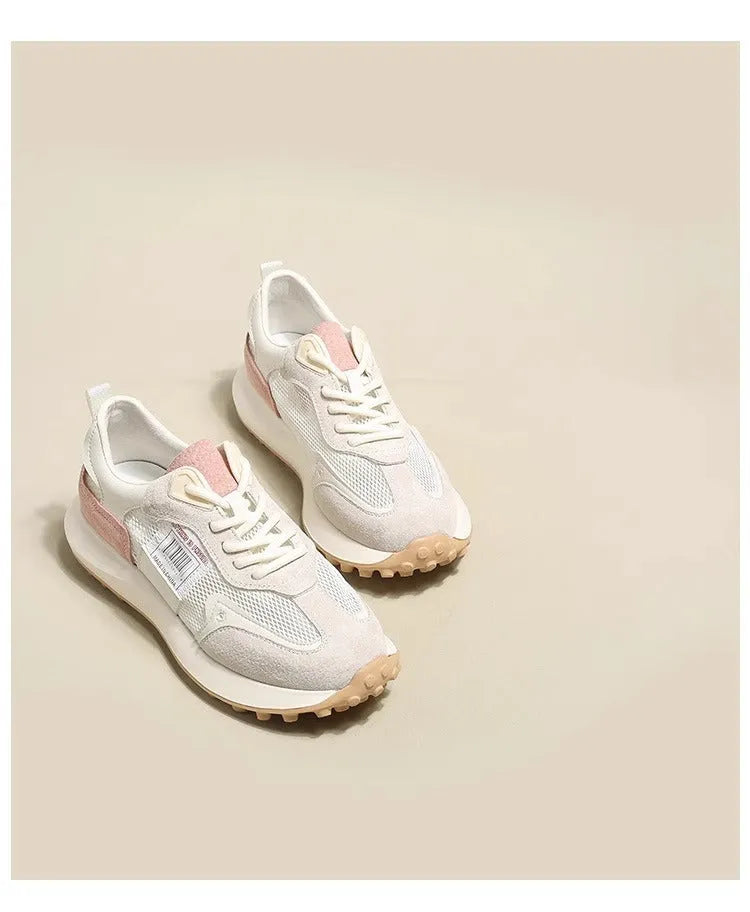 Women's grey and pink retro sneaker with low top design and round toe