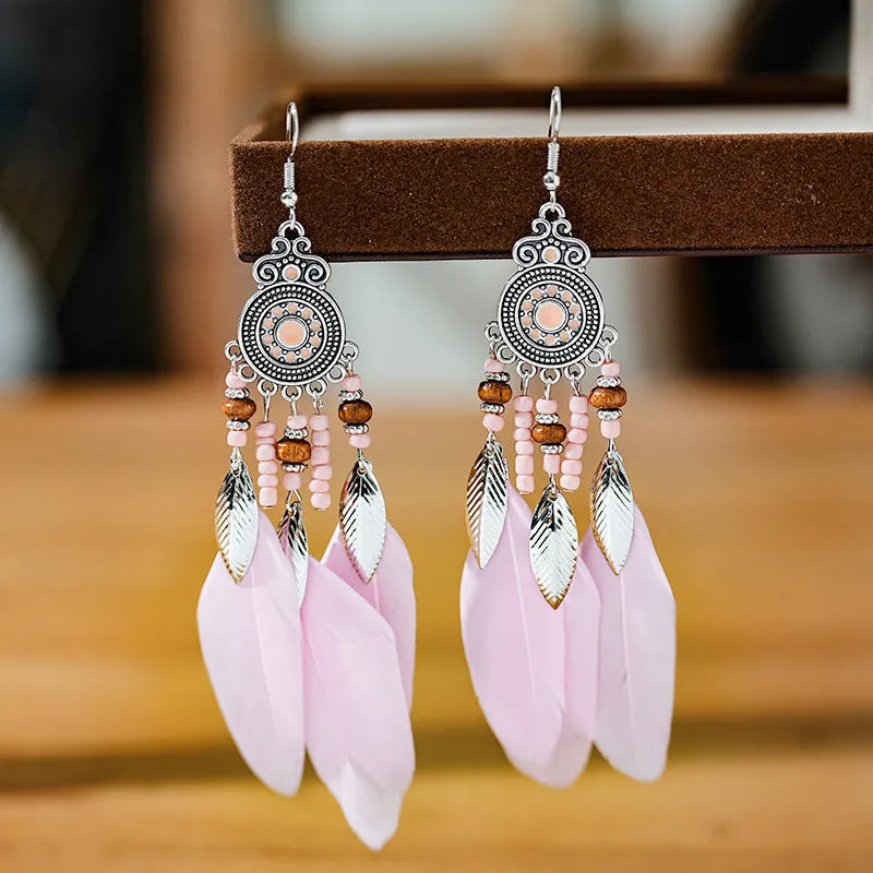 Handmade feather pattern bohemian earrings in multiple colours with leaf design detail