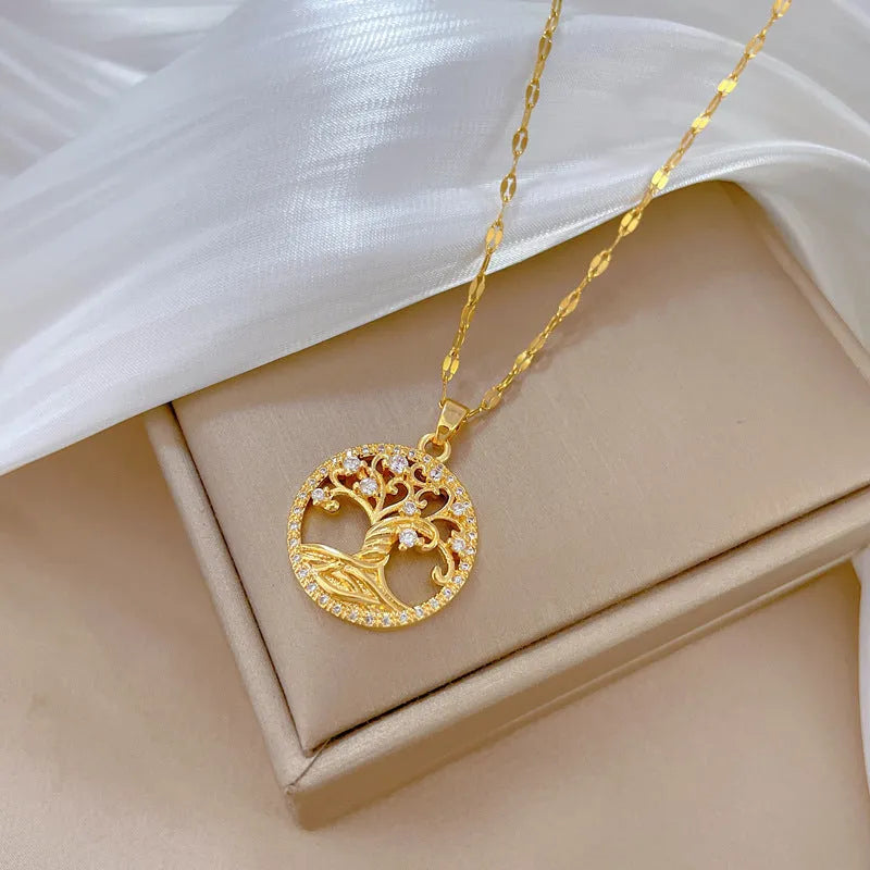 Gold-plated necklace with mother-of-pearl pendant and micro-inlaid rhinestone details on an adjustable chain.