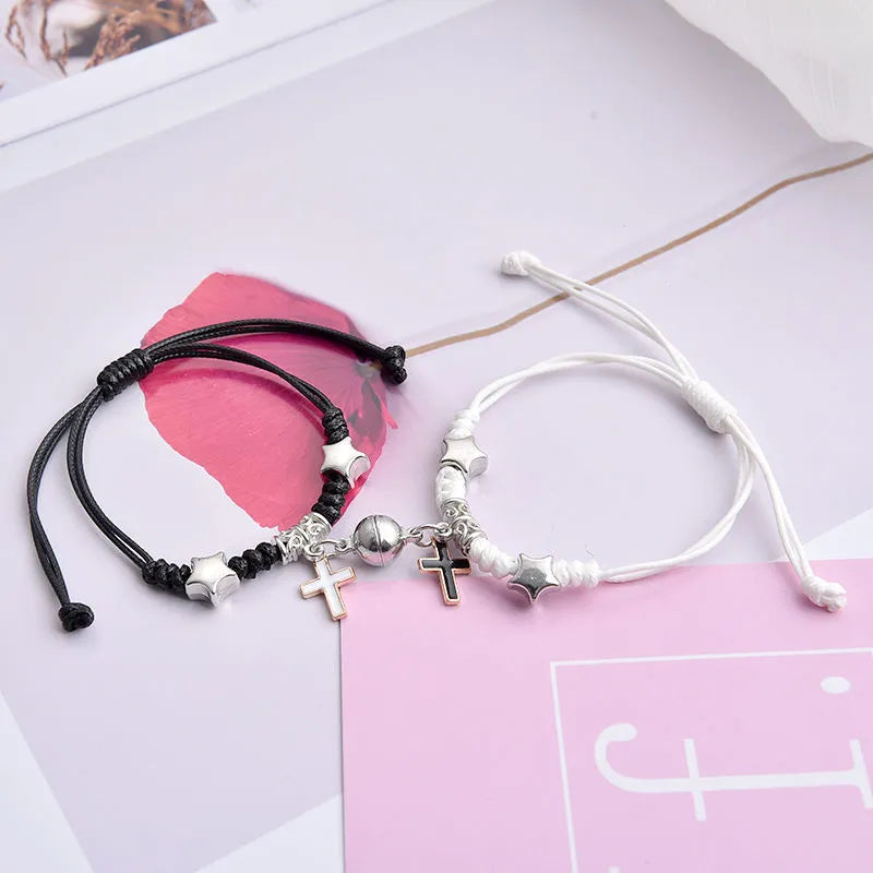 Magnet suction couple bracelets with alloy construction and various pendant designs including crowns and hearts