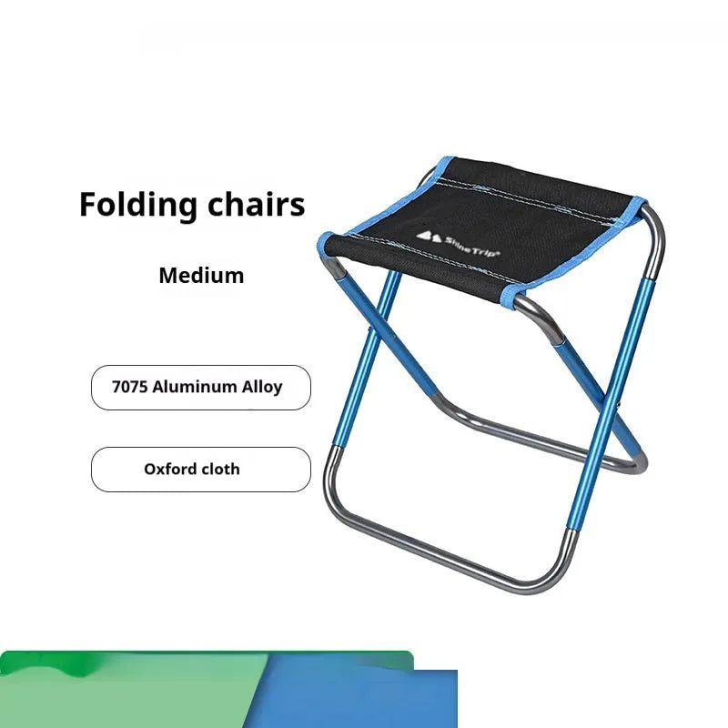 Black folding camp stool with aluminium alloy frame, shown in folded and open positions.