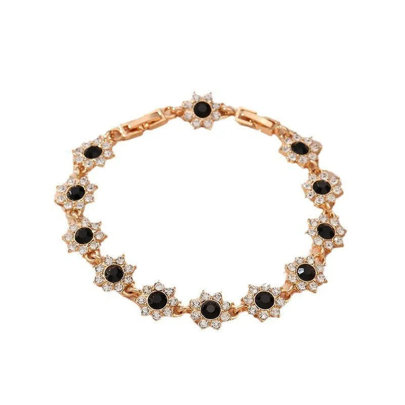Floral zinc alloy bracelet in electroplated gold and silver colour variants with crystal and diamond effects