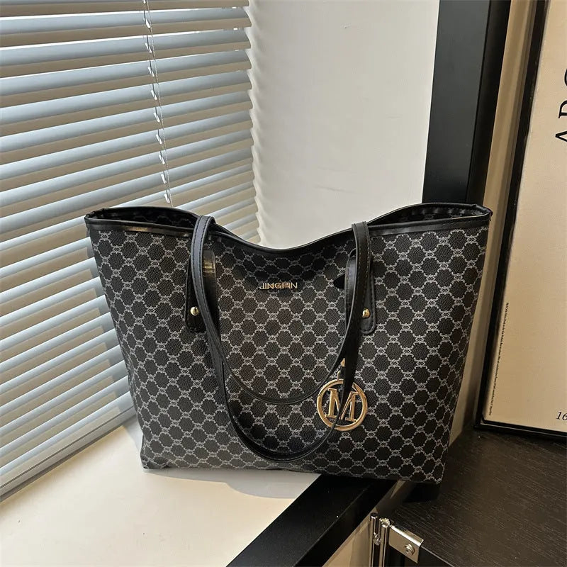 Black PU street-trend shoulder bag with sewing thread detail, shown with a 42cm wide top opening.