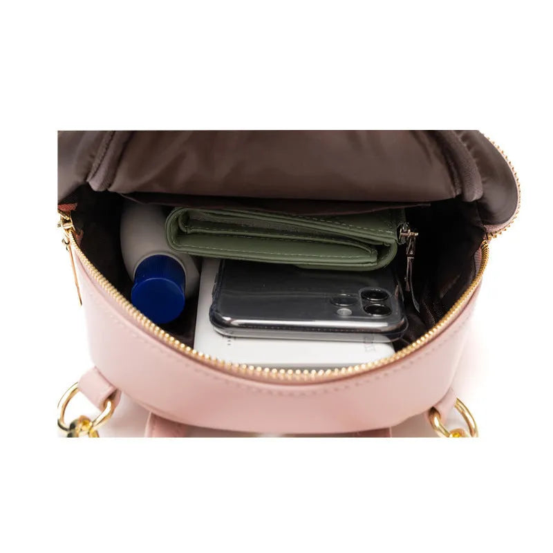 Soft PU mini backpack in street trend style with contrast colour detailing and external pocket.