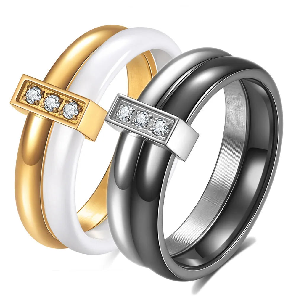 Glossy stitch and zirconium inlay ceramic ring for women in gold white on a geometric band.