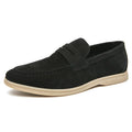 Men's black leather slip-on casual shoes with a round toe and rubber sole on a white background.