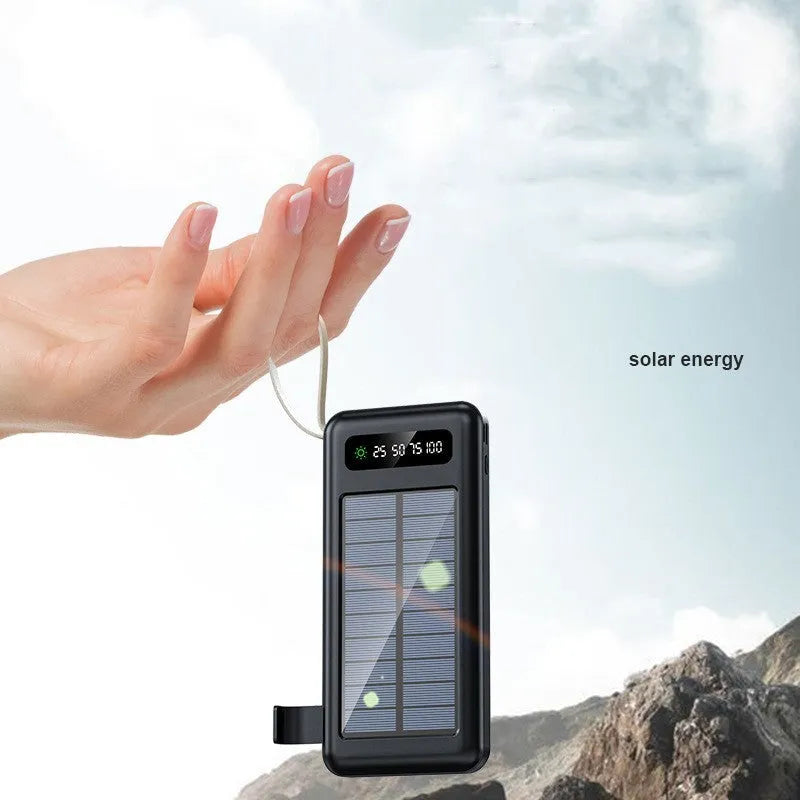 Cool black and ivory white solar power bank with capacity display and charging cable.