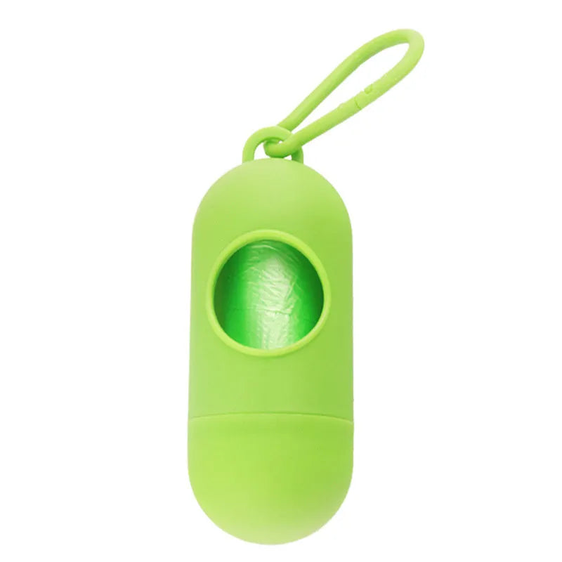 Black plastic dog poop bag dispenser with Velcro strap and a side metal hook.