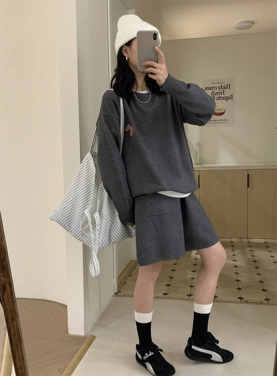 Women's milk blue knitted sweater and shorts suit with embroidered animal pattern.