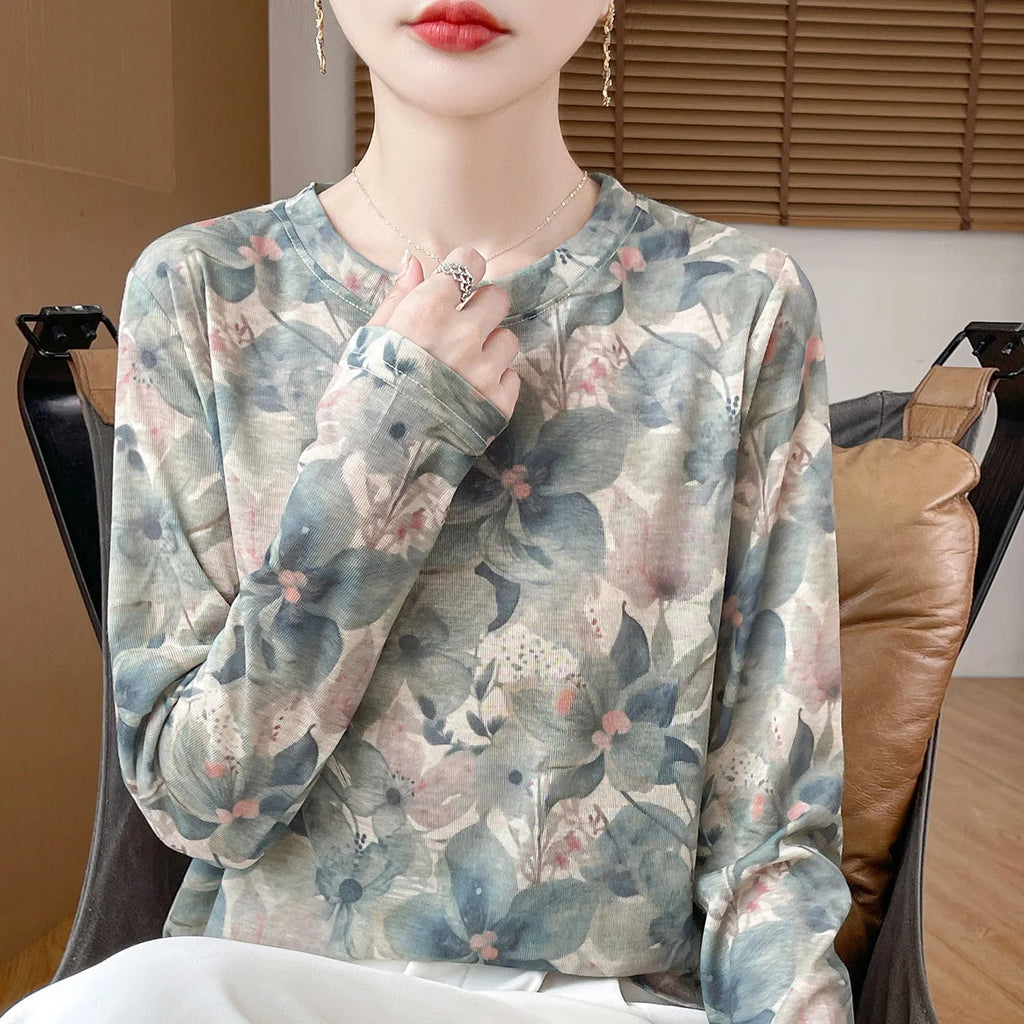 A women's round neck pullover in a Tencel cotton knitted fabric, shown in a printed colourway with regular sleeves.