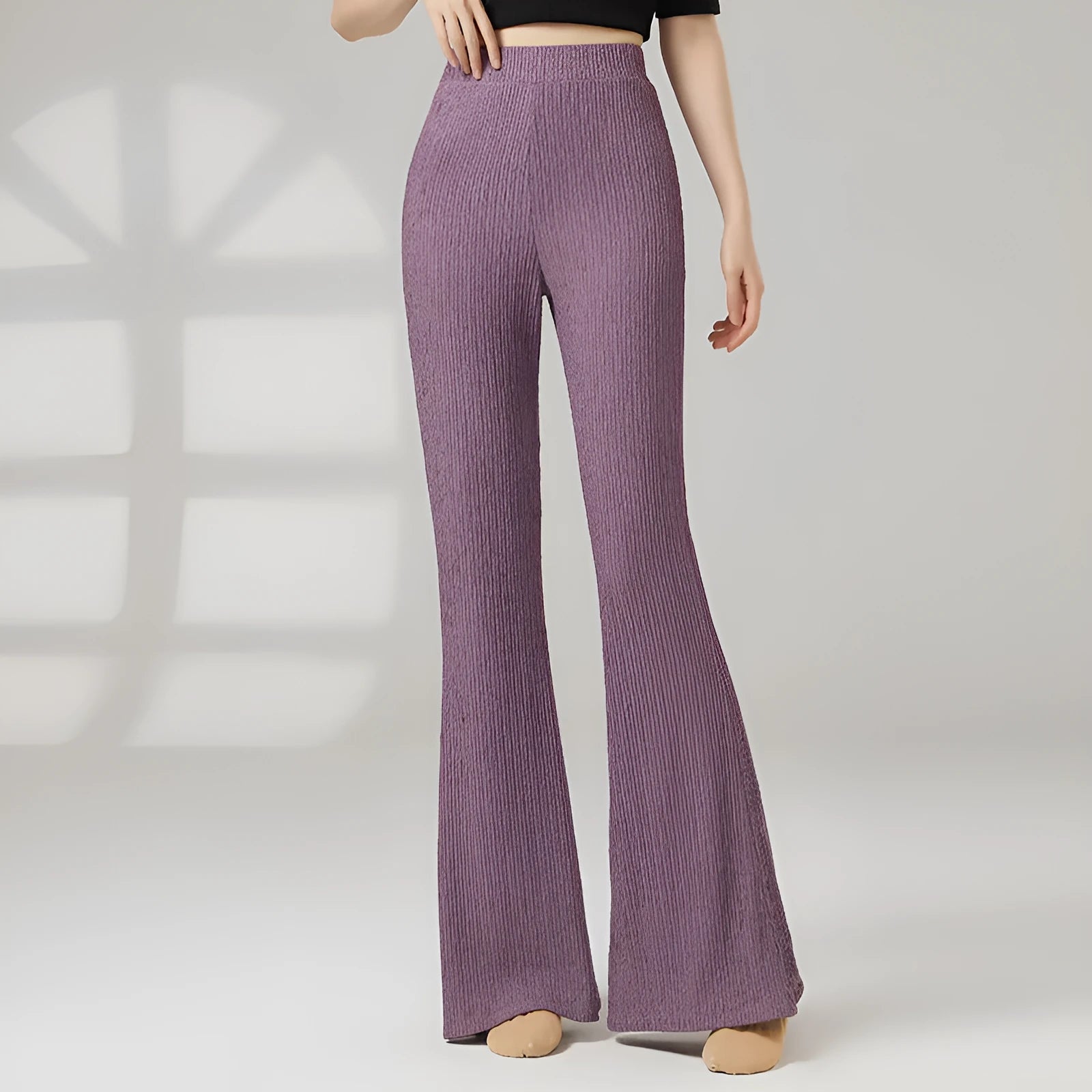 Adult female classical dance practice trousers in beige apricot, shown flat.