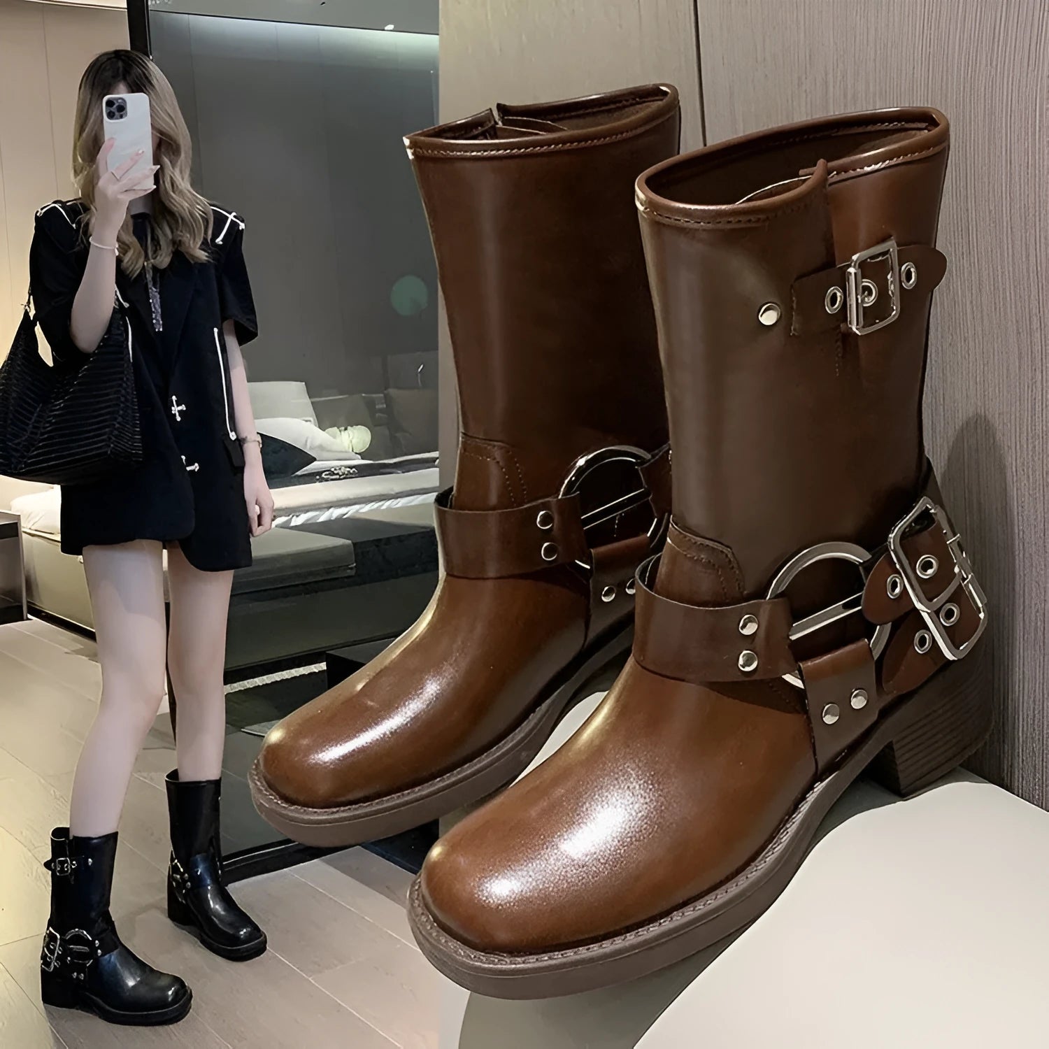 Women's black platform boots with buckle detail at calf length