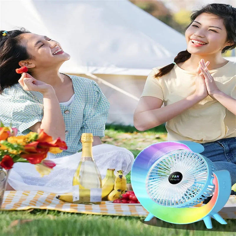 Desktop mini fan with night light in grass green showing 180-degree tilt and USB port
